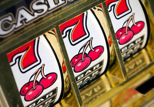 aquatoto slot games interface showing multiple game tiles with stakes and spin controls